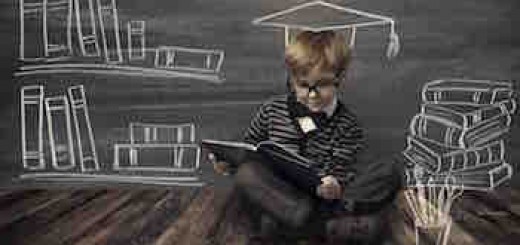 移动在线教育到底影响四大教育类型多深？Child Little Boy in Glasses Reading Book over School Black Board with Chalk Drawing, Kids Preschool Development, Children Education Concept